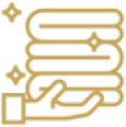 Gold folded towels on hand icon.