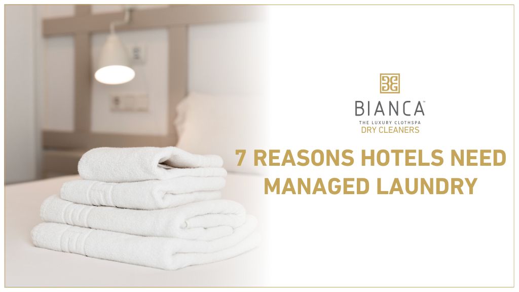 Stack of clean white towels in hotel room – managed laundry service benefits for Mumbai hotels.