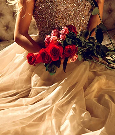 Elegant couture gown with intricate embroidery and delicate fabric detailing