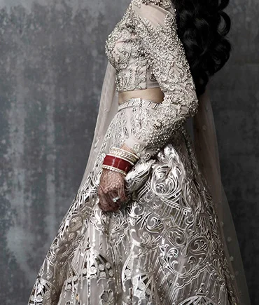 Intricately embroidered bridal lehenga with delicate embellishments requiring specialised garment care
